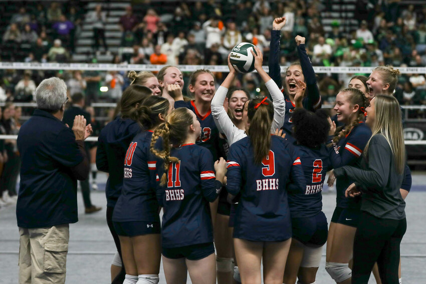 The Wolves celebrate after finishing eighth at the state tournament on Nov. 11 in Yakima.