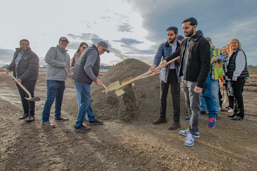 TA Napavine co-owners Damanjit Singh, Gurinderjit Sidhu and Manpreet Singh turn dirt during a groundbreaking ceremony on Tuesday, Nov. 21, with Napavine City Councilor Brian Watson, Napavine Mayor Shawn O'Neill, Napavine Public Works Director Bryan Morris, Napavine Police Chief John Brockmueller and other city staff as they celebrated the beginning of construction of a new TA truck stop off Exit 72 on I-5.