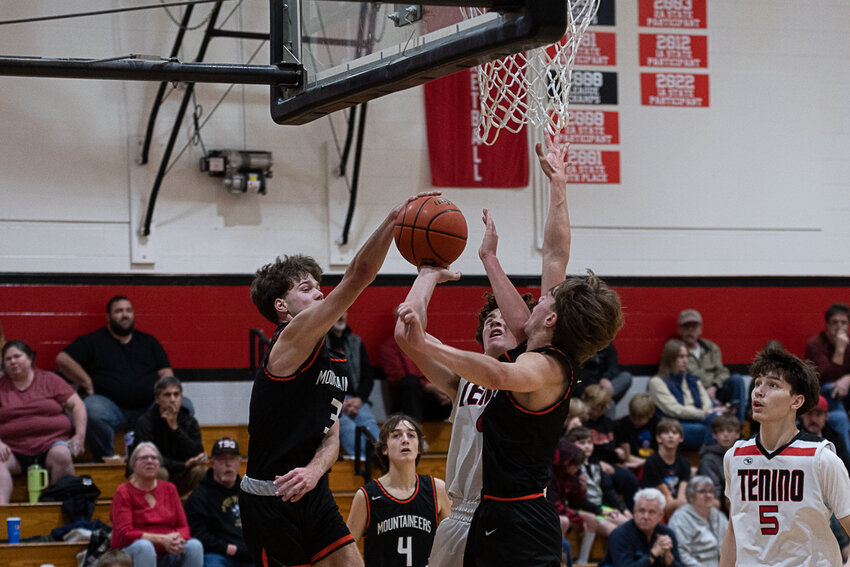 Josh Meldrum blocks a layup attempt during Rainier's win over the Tenino on Nov. 30.