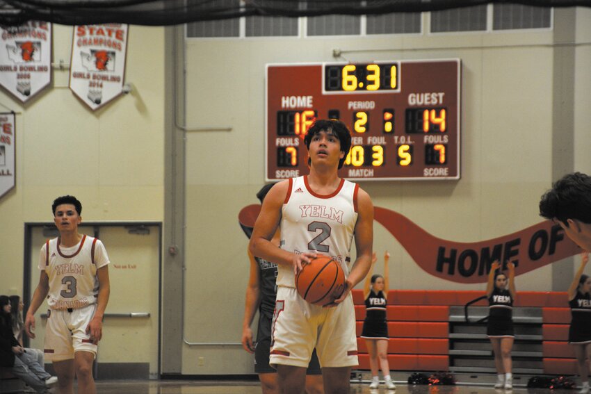 Junior Marius Aalona exhales prior to a free-throw attempt during the 2022 season.