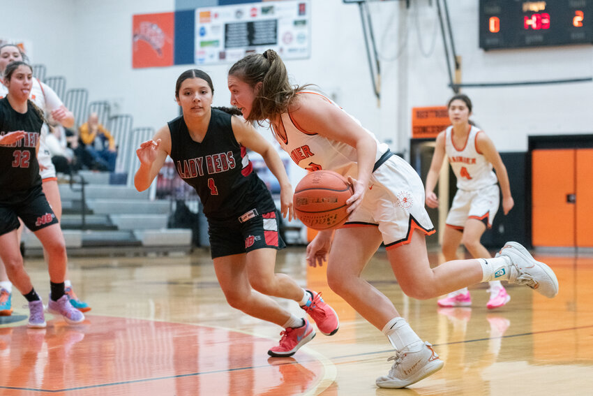 Bryn Beckman drives into the paint during Rainier's 56-41 win over Neah Bay on Dec. 5.
