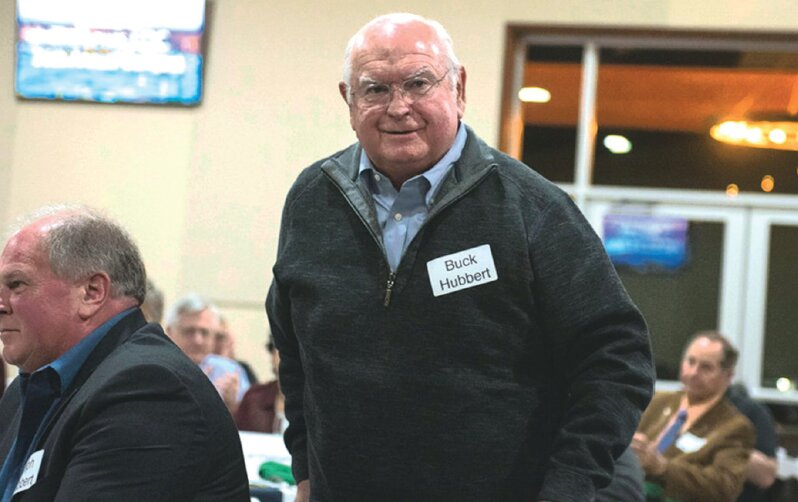Buck Hubbert stands up to present the Gail and Carolyn Shaw Industry Award at the Lewis EDC annual banquet a few years ago in this Chronicle file photograph.
