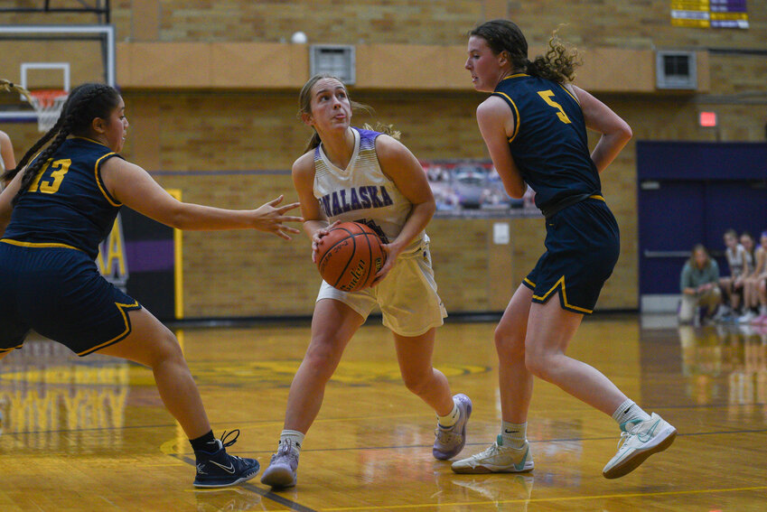 Jaycee Kinsman takes the ball into the key during Onalaska's 53-43 loss to Forks on Dec. 27.