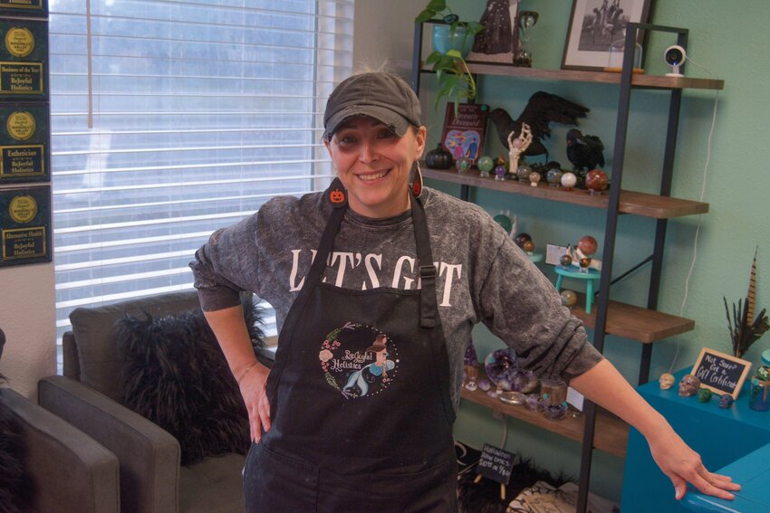 Joy Hiebert smiles at her store, BeJoyful Holistics, ahead of the Halloween season.