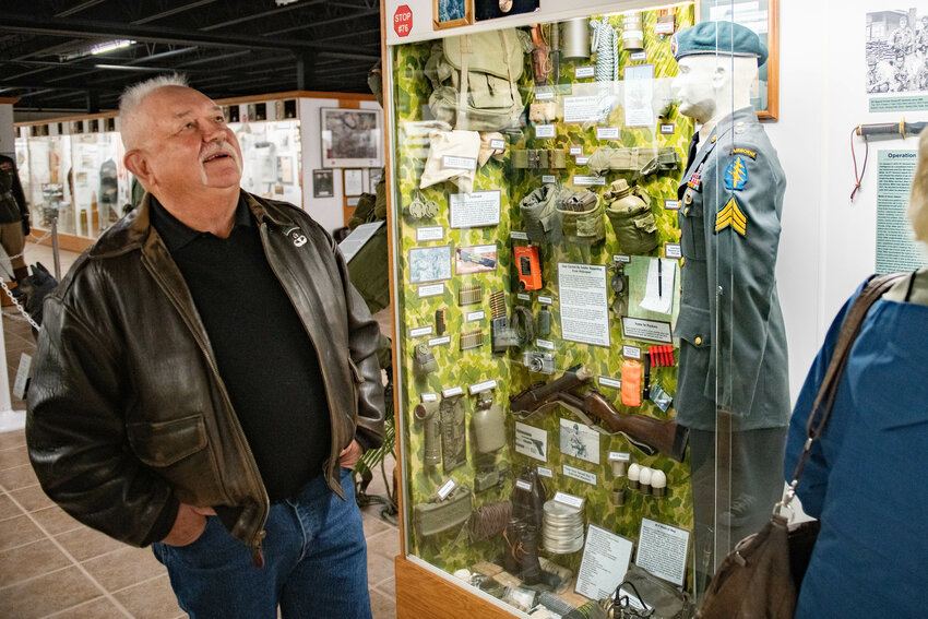 Attendees observe a display honoring Medal of honor recipient Franklin D. Miller after a ceremony at the Veterans Memorial Museum in Chehalis on Jan. 5.