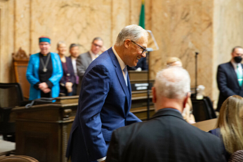 Gov. Jay Inslee exits the dais after delivering his final State of the State address, where he vowed to &quot;run through the tape&quot; during his last year in office.