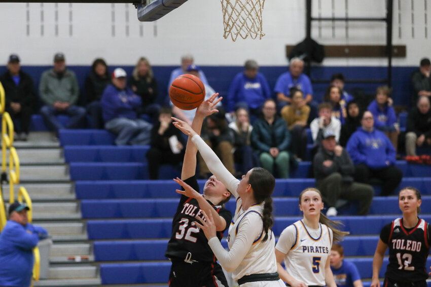 Bailey Chapman sways away a shot during the second half of Adna's 65-31 win over Toledo on Jan. 18, in Adna.