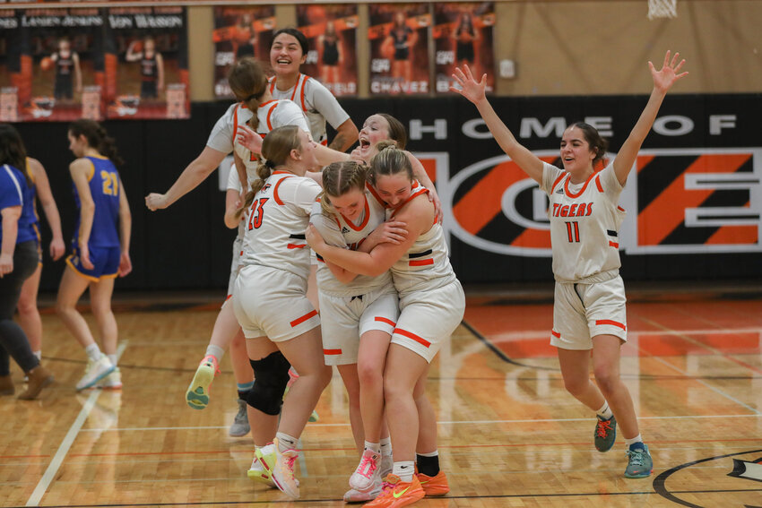 Centralia players celebrate after the final buzzer sounds on their 58-55 win over Rochester on Jan. 19.