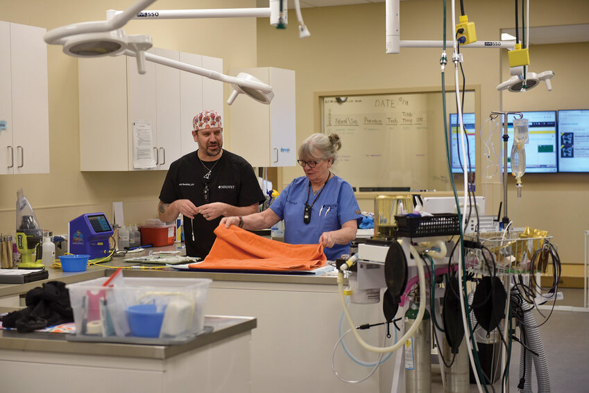 Anesthesiologist Julie Smith and her assistant prepare their work area to provide care for a patient at MetVet in Vancouver.