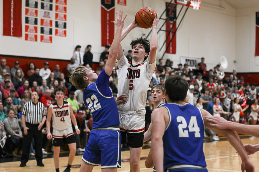 Noah Schow shoots over an Elma defender during Tenino's win over Elma on Jan. 31.
