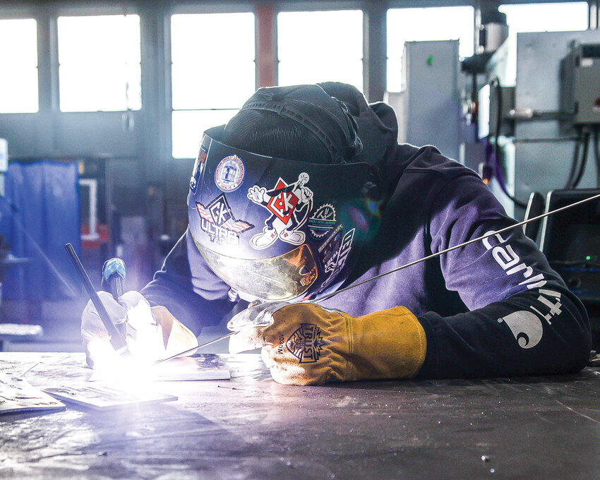 photo by cade barker  Aiden Goncalves, a Battle Ground High School junior who is in the welding program, works on his welding skills on Thursday, Feb. 1.