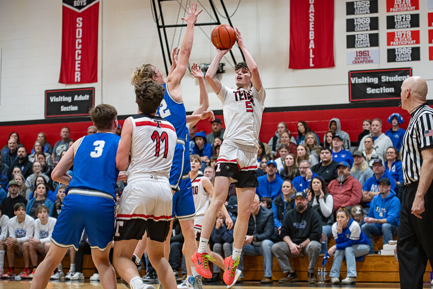 Noah Schow takes a shot during Tenino's 63-52 win over Elma on Feb. 9.