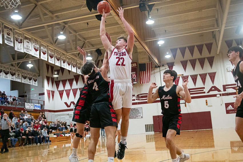 Cooper Fallon takes a shot during Toledo's loss to Wahkiakum on Feb. 17 in Chehalis.