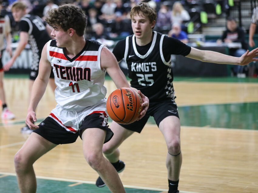 Tenino's Jack Burkhardt (11) backs down King's Connor Steen in Wednesday's Class 1A Round of 12 contest in Yakima.