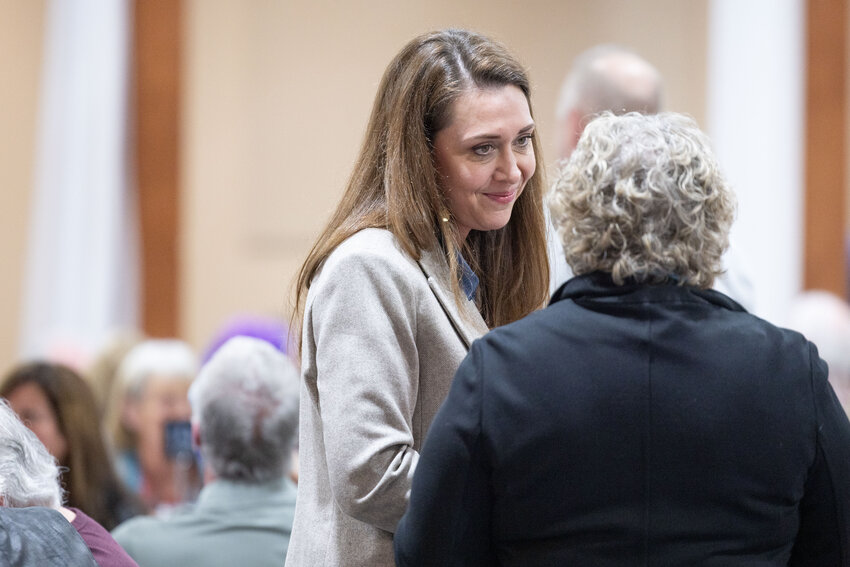 Candidate for Public Lands Commissioner Jaime Herrera Beutler speaks with another attendee during a fundraiser at Jester Auto Museum in Chehalis on Monday, March 25.