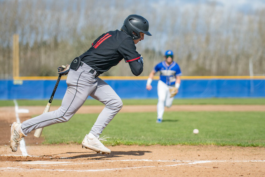 Rohan Feigenbaum lays down a bunt and heads for first during Adna&rsquo;s win over Toledo on April 9, 2024.