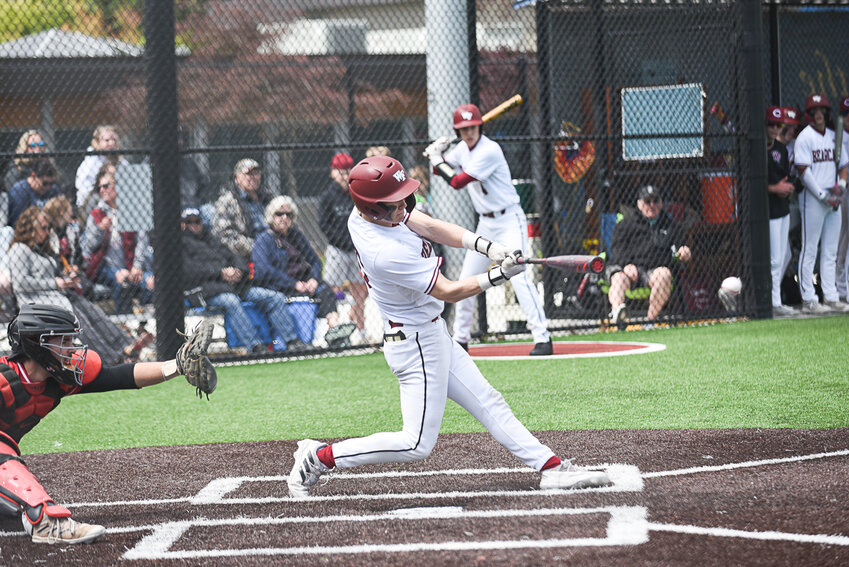 W.F. West's Deacon Meller drills a base hit to left during W.F. West's district quarterfinal against R.A. Long at Centralia College on May 7, 2024.