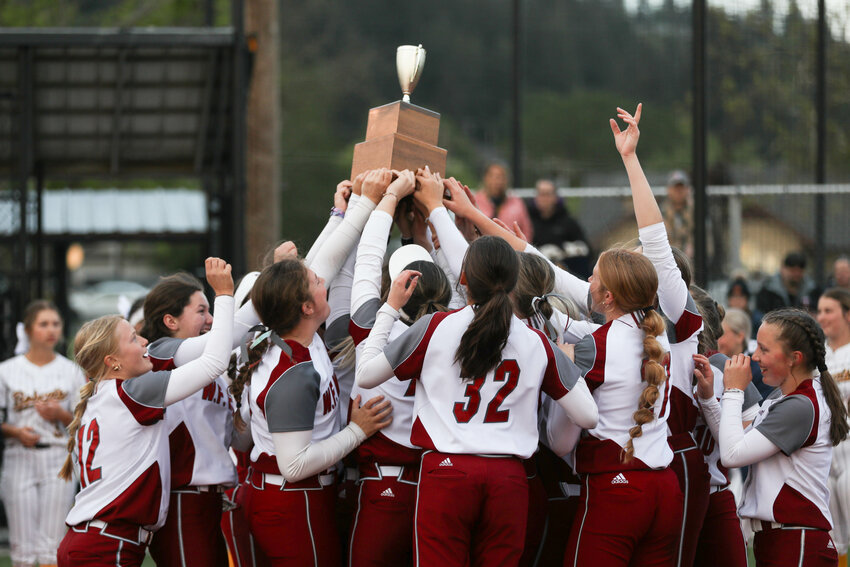 The Bearcats celebrate with the trophy after defeating Aberdeen in the 2A District 4 title game in Chehalis on May 17.