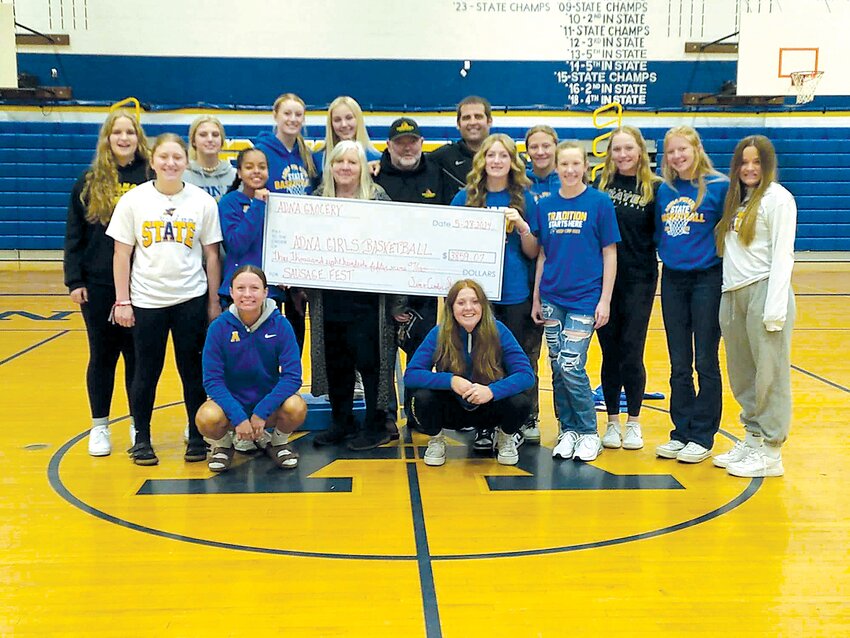 Jim and Cindy Smith, owners of Adna Grocery and Uncle Jim&rsquo;s Smokehouse, present members of the Adna girls basketball team with a check for $3,859, money raised during the first Adna Sausage Fest held earlier this month at the Adna Grange. It&rsquo;s the couple&rsquo;s second major contribution to local athletics this year. They presented members of the Adna High School football program with a check for $5,342.63 after hosting the Adna Crab Feed fundraiser in April. Also pictured are Danika Hallom, Kendall Humphrey, Gaby Guard, Karsyn Freeman, Bailey Chapman, Ava Humphrey, Alyssa Carroll, Alyson Terry, Ava McCauley, Taylor Johnson, Carmen Chapman, Presley Strodemeir, Leiya Medina, Kamryn Freeman, Muse Jones and Leia Medina. To submit news tips and photos to The Chronicle, email news@chronline.com.