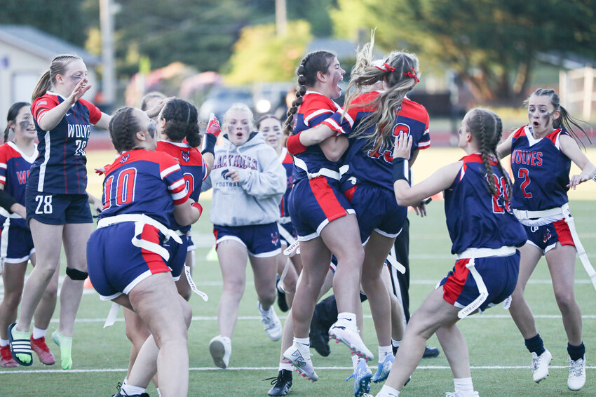 Members of the Black Hills girls flag football team celebrate beating Tumwater 13-12 in double overtime on Thursday night at Tumwater District Stadium.