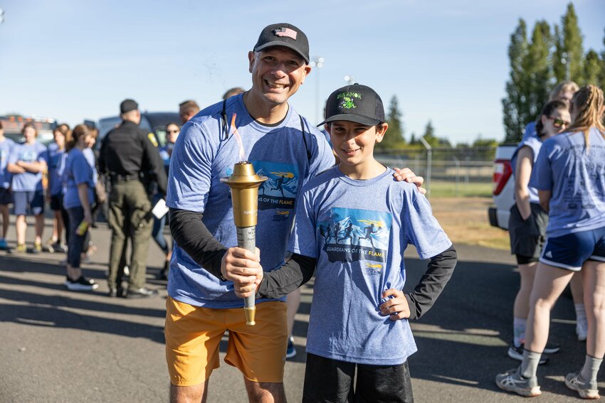 Rep. Peter Abbarno and Antonio Abbarno pose for a photo during the Lewis County Special Olympics Law Enforcement Torch Run on Friday, May 31, 2024.