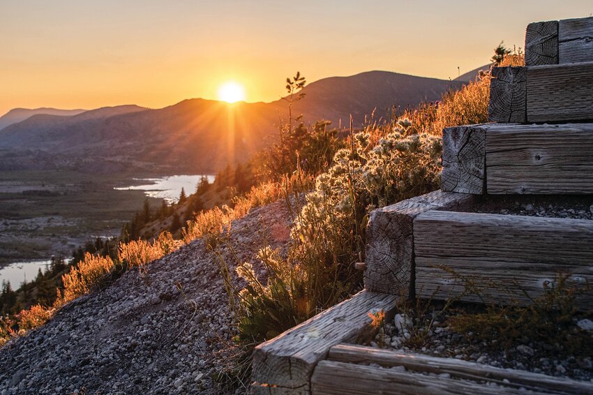 Sun shines over hills on the stairs leading to the top of Windy Ridge Viewpoint at Mount St. Helens on Tuesday, July 9.
