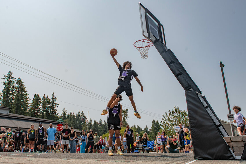 Tenino Oregon Trail Days dunk contest winner Trevontay Smith throws down a dunk on Saturday, July 27.
