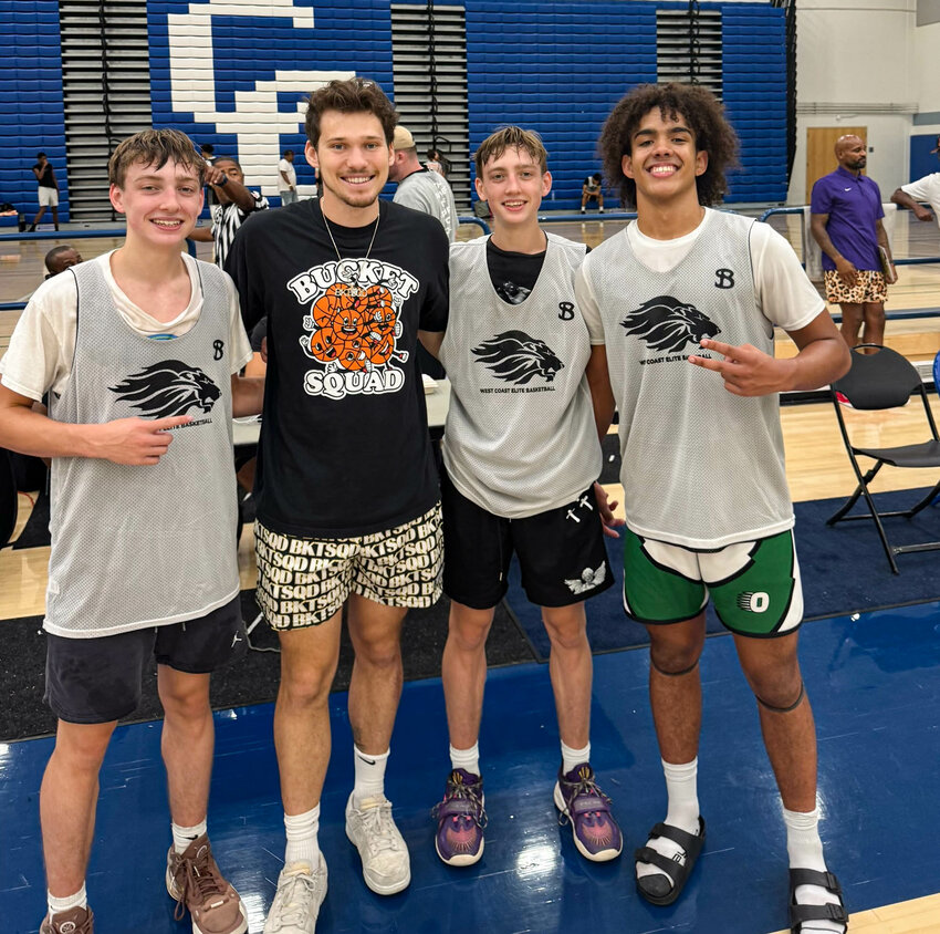 Black Hills' Quinton Morrill (far left), Talon Morrill and James Morgan pose for a photo with YouTuber Jesser at the top-100 showcase this weekend in Los Angeles.
