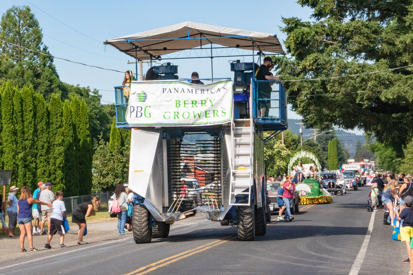 The Panamerican Berry Growers berrypicker rolls down East State Street during the Mossyrock Blueberry Festival parade on Saturday, Aug. 3.