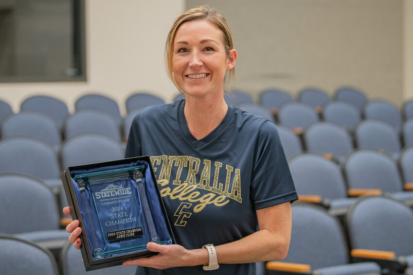 Jamie Cline, winner of the 2024 Statewide Inspirational Speech Championship, smiles with her first place trophy at Centralia College on Monday, Aug. 5.