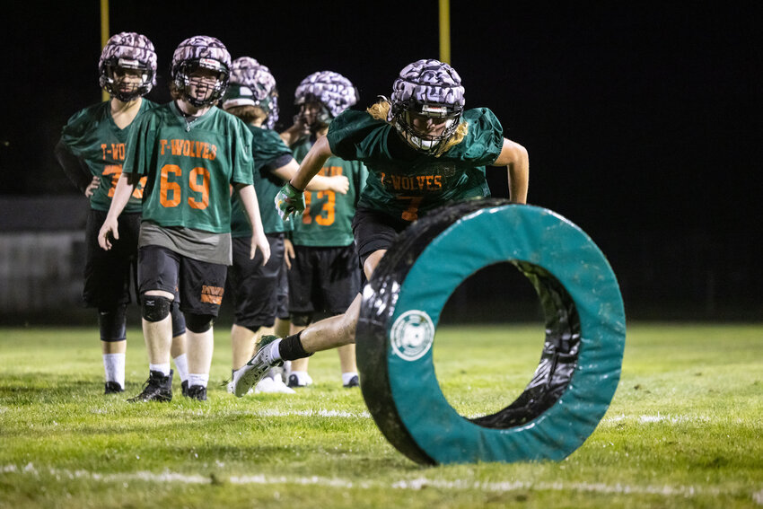 Players run through drills during the first Morton-White Pass High School football practice of the season in Morton on Wednesday, Aug. 21.