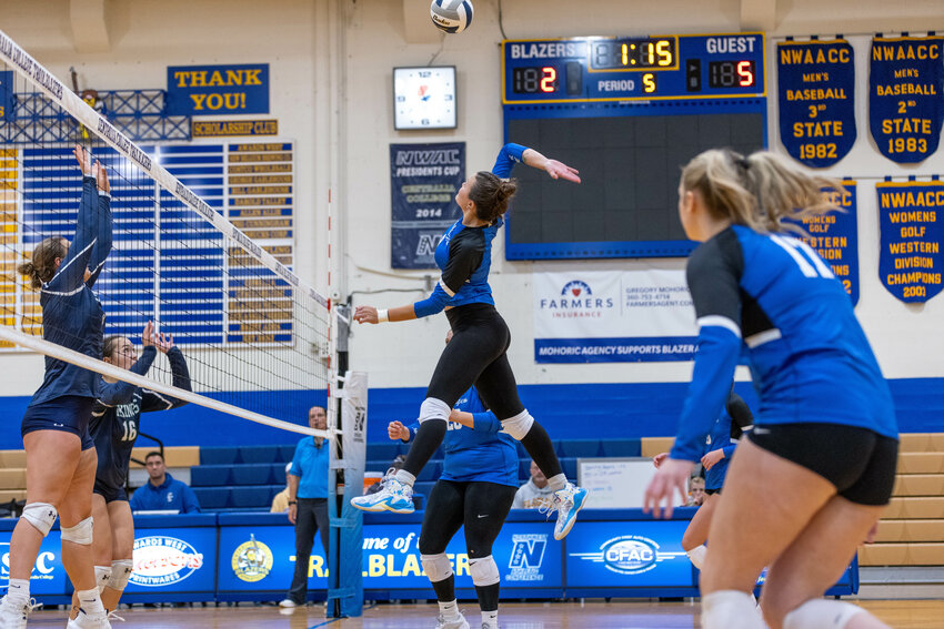 Centralia College's Analiese Martin spikes the ball during CC's first match of the Blazer Classic against Big Bend on Aug. 23.
