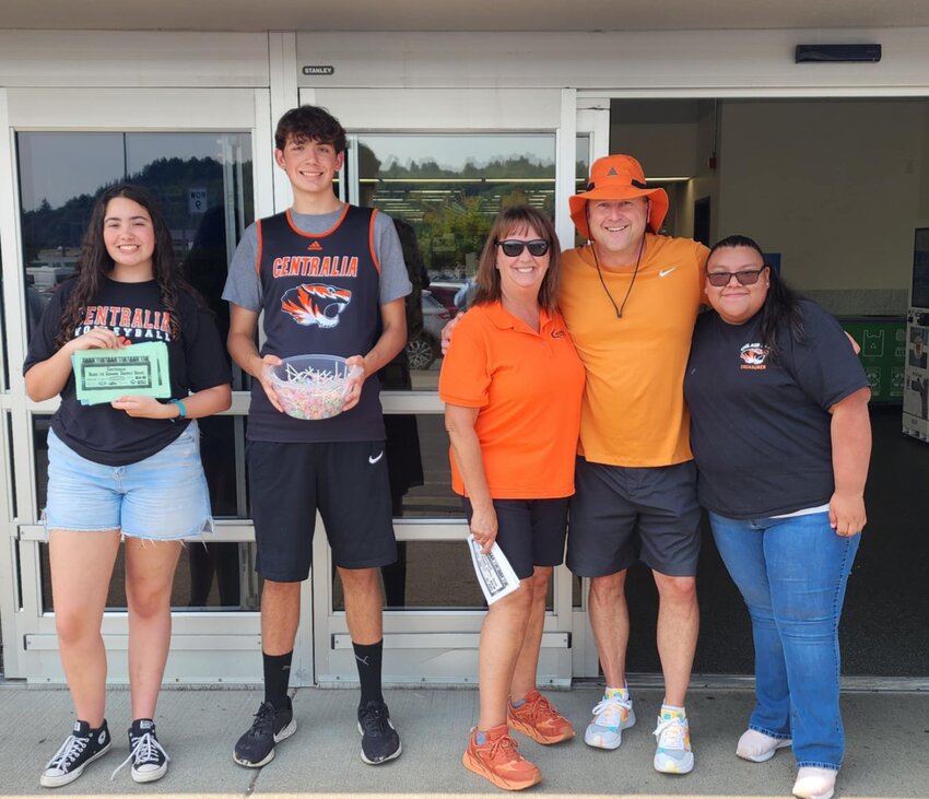 Centralia School Board Member Deb Parnham and Centralia High School Principal Scott Embrey join ASB Treasurer Brianna Hernandez Perez and Centralia students at the Centralia Back-to-School Supply Drive at Walmart in Chehalis earlier this month.