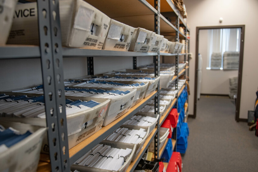 FILE PHOTO &mdash;&nbsp;Boxes of ballots sit on shelves as votes are manually recounted in a secured room at the Lewis County Courthouse in Chehalis on Monday, Aug. 26.