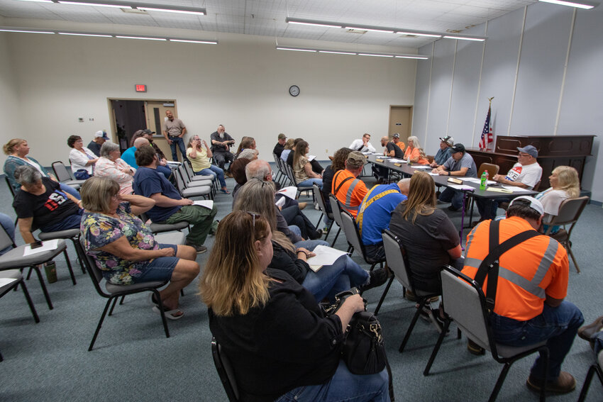 The Morton City Council listens while a Morton resident expresses anger over the recent announcement of fraud allegedly committed by a former city staff member during the council's Monday, Aug. 26, meeting inside the Bob Lyle Community Center.