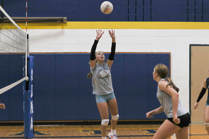Adna's Danika Hallom sets the ball for a teammate during Adna's practice on Aug. 29.
