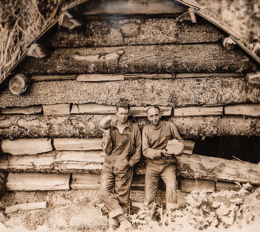 According to Marc Myrsell, who provided this photo and description, miners Leroy Perry Smith and Fred Beck stand outside of the cabin where the alleged attack took place. The Chronicle could not confirm the legitimacy or date of the photo.