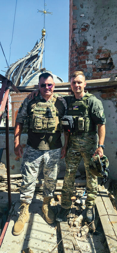 Mikhail Pavenko and fellow chaplain Gennadiy (left) stand outside of a church damaged by a Russian air strike in the city of Orikhiv, Ukraine. Pavenko noted Russia&rsquo;s aggression has resulted in the death of over 60 ministers and the destruction of 630 places of worship in the region.