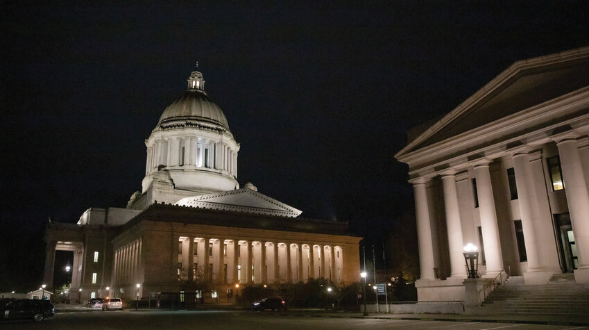 The Capitol building in Olympia, home to the Senate and House chambers, is lit up on the evening of Thursday, Feb. 16, 2023.