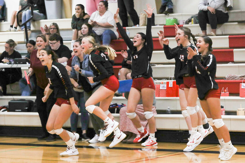 The Mossyrock bench celebrates after the final point of Mossyrock's win over Onalaska on Sept. 16.