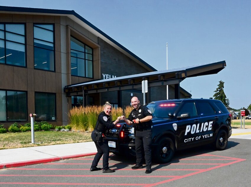 Averie Ford and Dustin Stephan pose for a photo outside Yelm Middle School.