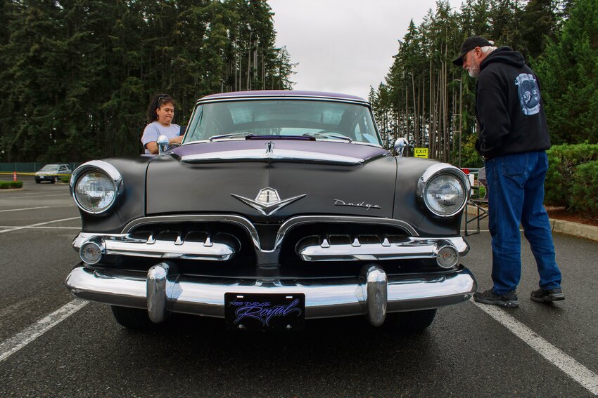 A visitor checks out Lori Walston's 1955 Dodge Royal at the Yelm FFA Alumni Car Show at Yelm High School on Sept. 14. Dozens of cars filled the parking lot in an event that raised about $6,000 for the FFA program.