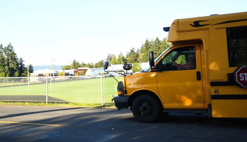 A school bus drives past Cascade Middle School on Monday, Sept. 16 in Longview. Cascade and Mt. Solo Middle School expanded their security measures that day after the district reports receiving online threats focusing on those schools.