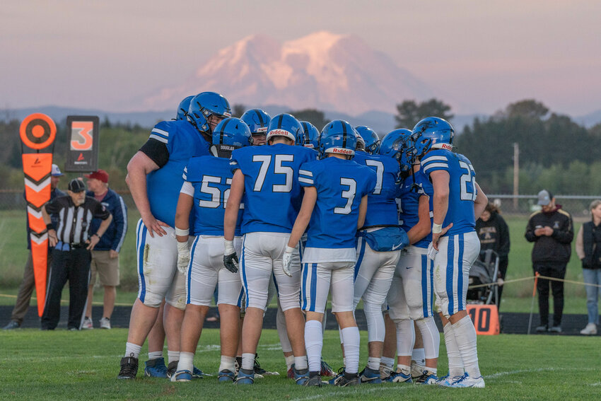 The Pirates huddle during Tenino&rsquo;s 22-19 win over Adna at Adna High School on Friday, Sept. 20.