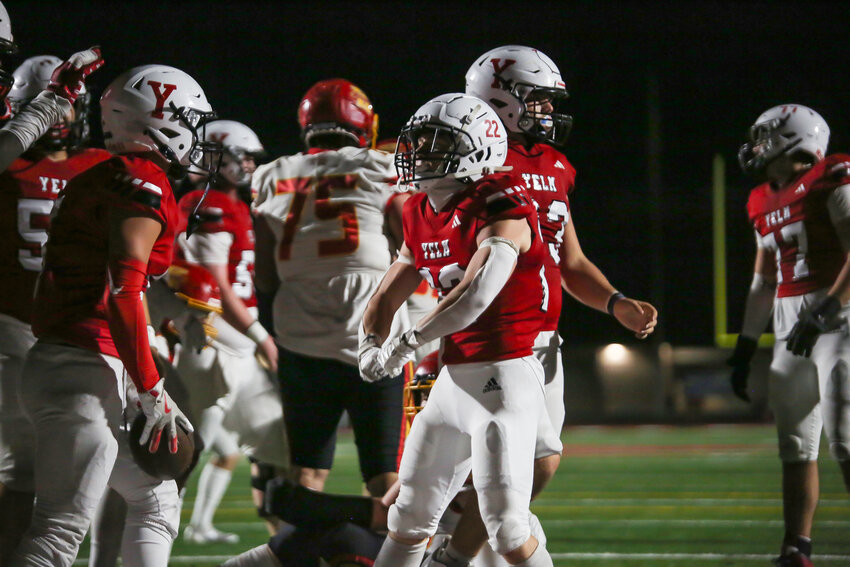 Ethan Owens (22) celebrates Marcus Ronquillo's touchdown run against Kamiakin on Sept. 20.