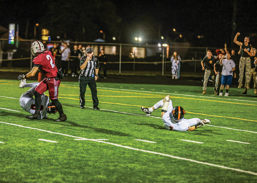 With just seconds left on the clock, Prairie&rsquo;s Jackson Kimball spins out of a tackle for a 39-yard touchdown to win the game over the Battle Ground Tigers in the massive north county rivalry, 43-38, on Friday, Sept. 20.