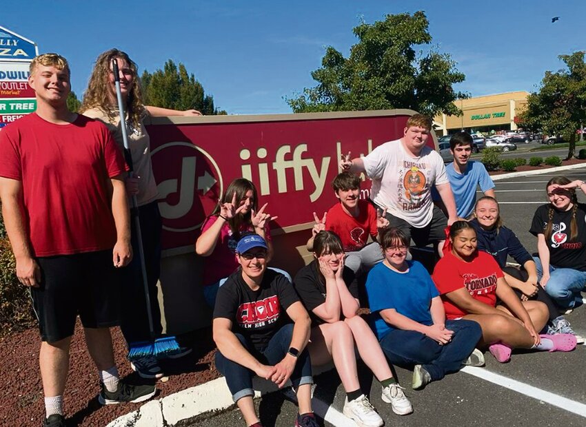 Members of the Yelm High School Chamber Choir take a break from their car wash fundraiser at Jiffy Lube to pose for a photo on Sept. 21.