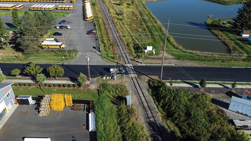 The railroad crossing on Eaton Boulevard marks the division between the control asphalt overlay on the west side and the experimental asphalt mixture, which contains three-quarters of 1% waste plastic, on the east side.