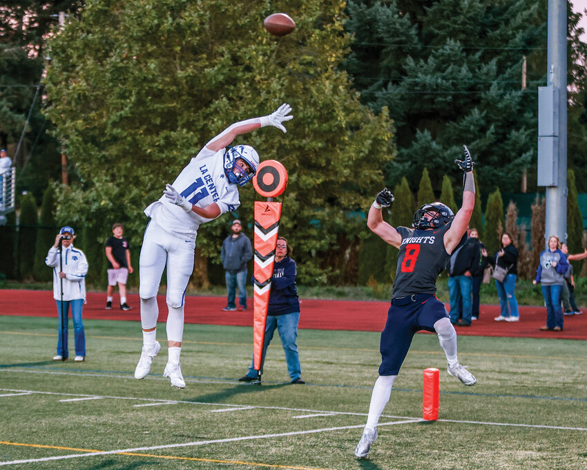 La Center&rsquo;s Parker McKinney leaps early in the end zone defending King&rsquo;s Way Christian&rsquo;s Sam Somarakis, who nearly pulled in the touchdown grab during the La Center Wildcats&rsquo; 34-0 win on Friday, Sept. 27.