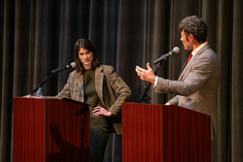 Incumbent Marie Gluesenkamp Perez, left, reacts to a statement from challenger Joe Kent during a Washington 3rd District Congressional debate at Lower Columbia College in Longview on Wednesday, Oct. 2.